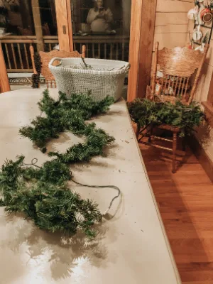 preparing the faux garland for adding cut branches
