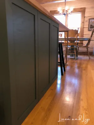 dark green cabinet with framed back