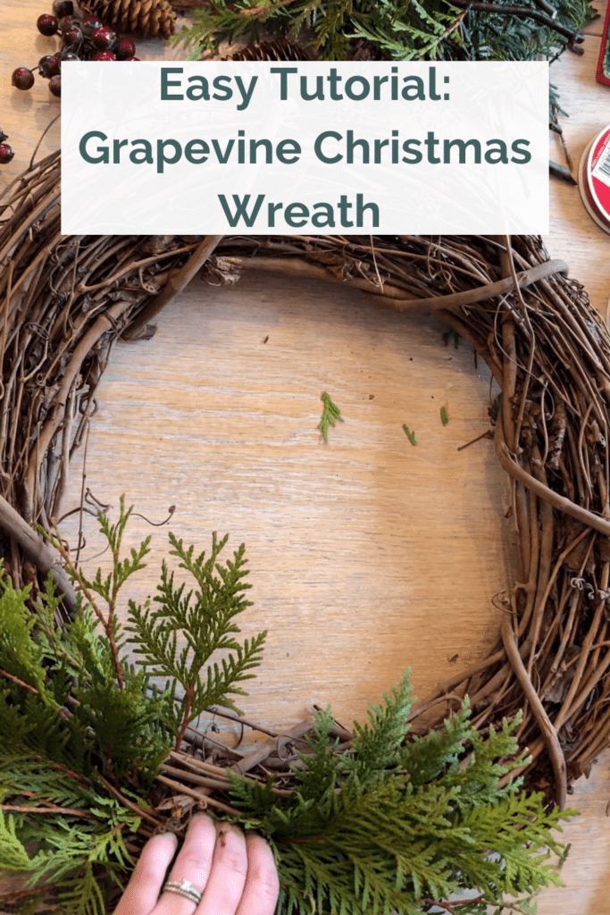 close up picture - adding cedar branches to grapevine wreath