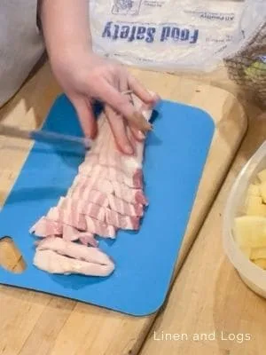 cutting bacon into small pieces