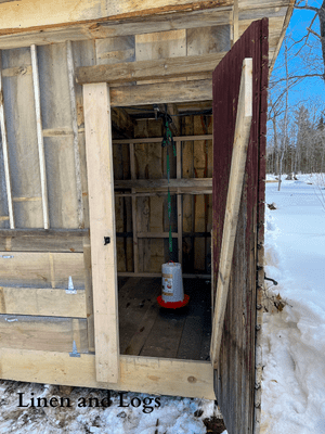 DIY Chicken Coop man door with plug in chicken waterer 