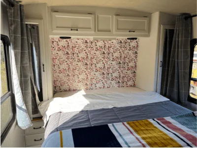 RV Motorhome primary bedroom with wallpaper