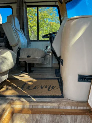 class a motorhome cockpit - looking in from the door to drivers seat